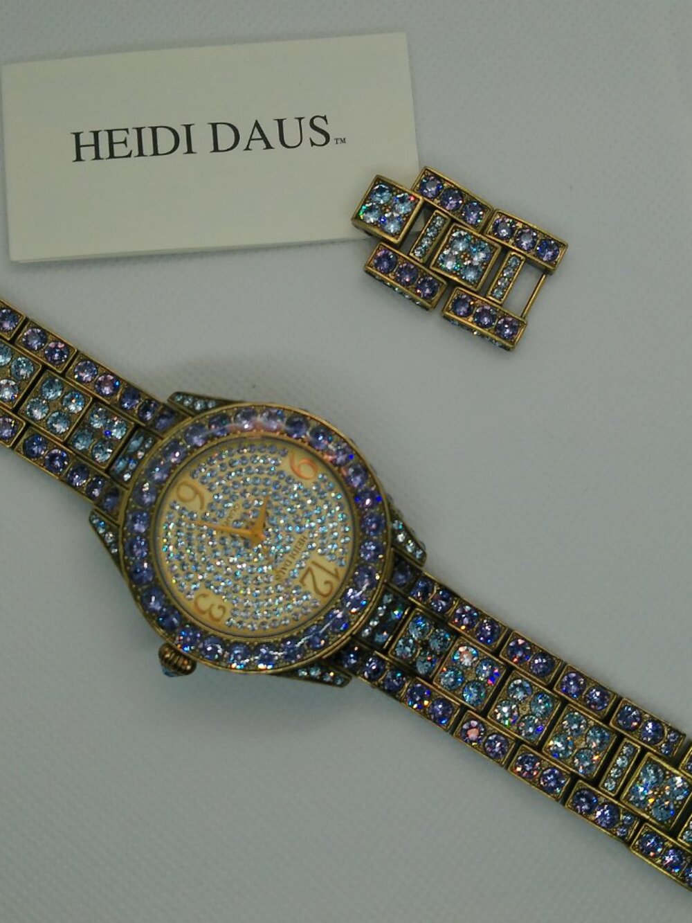 Heidi Daus quartz fashion watch bronze-tone covered with lavender-purple crystal